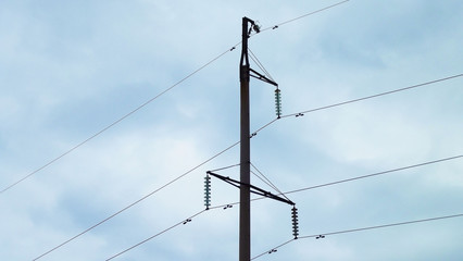 Electric poles and wires against the sky.