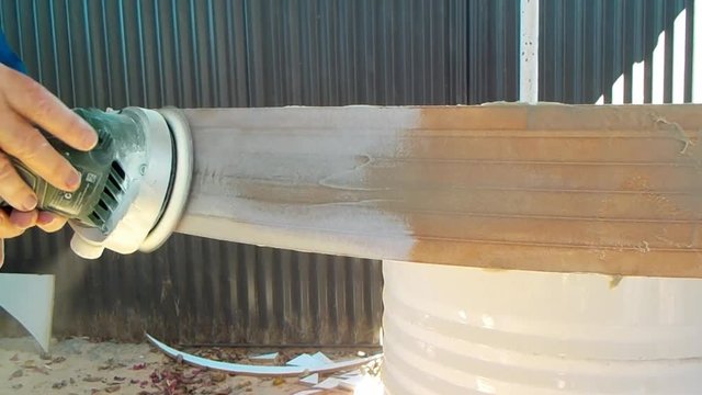Sanding a piece of MDF board
