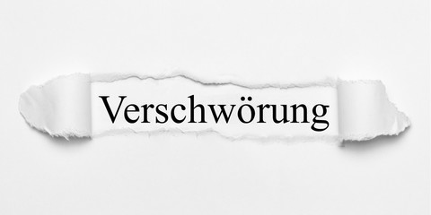 Verschwörung auf weißen gerissenen Papier