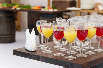 Set of wine and juice glasses on the banquet
