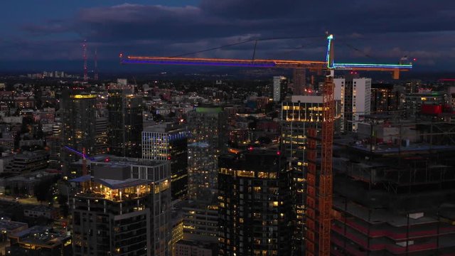 Neon cranes in Seattle at night