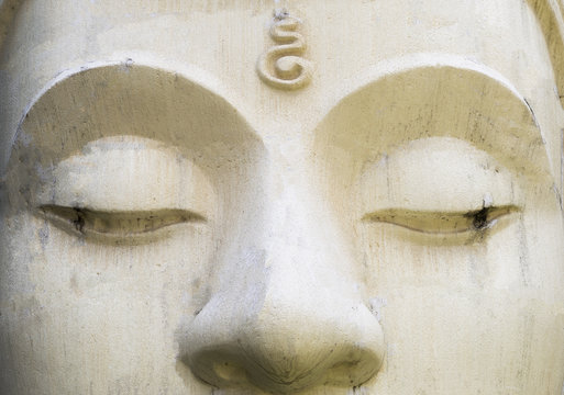 White cement Buddha image face, religion concept, Buddhism symbol