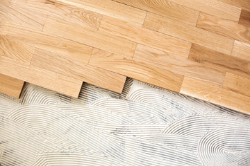 Subfloor mixture and assembled parquet plates - obrazy, fototapety, plakaty