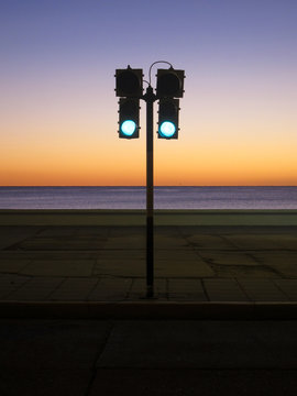 Green traffic light at sunrise. All ready to go concept