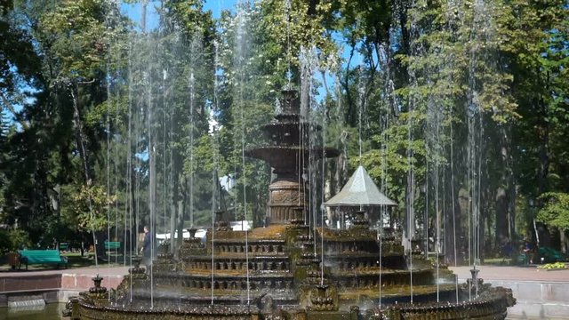 Beautiful fountain in city park, Baroque architecture. Steadicam shoot.