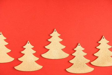 close-up view of decorative fir trees on red background
