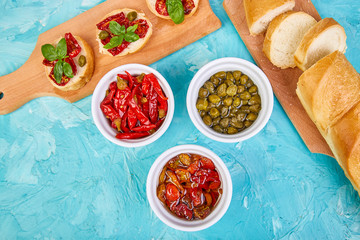 Bruschetta or crostini with sun dried tomatoes and capers