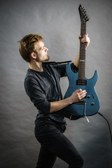 Fototapeta premium Man playing on electric guitar