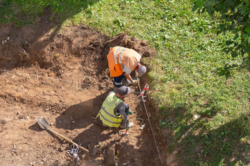 construction workers are building road, a sidewalk repair site