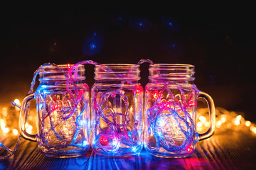 colorful lights in a glass transparent jars Christmas lights in the room