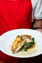 Food photography : Close up hand model / chef serving dish to customer