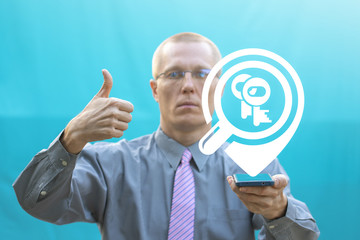 Caucasian man shows a thumb up and offers smartphone with keys magnifying glass location icon. Keyword Research Business concept. SEO Web Marketing Success Mobile Analysis.