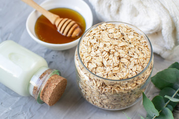 Natural Ingredients Homemade Body Oatmeal Sea Salt Scrub with Olive Oil Honey Milk White Towel Beauty Concept Skincare Organic Aroma Spa Therapy