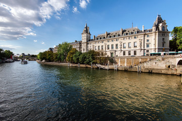 Paris, France - August 13, 2017. View of Conciergerie Palace and Prison on Cite island from Seine. Popular french landmark located on the west of the ile de la Cite, presently used for law courts.