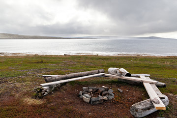 A place to relax with benches and a campfire on the shore of the northern Barents Sea