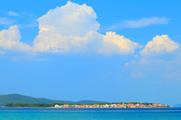 Fototapeta na wymiar Blue Adriatic sea and Island Krapanj near Sibenik touristic destination, Croatia