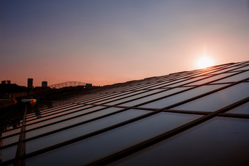 The glass roof of the library of the University of Warsaw at sunset