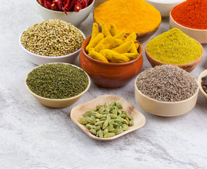 Indian Spices Collection Also Called Red Chili, Turmeric Powder, Coriander, Fenugreek, Mustard Seed, Salt, Turmeric Stick, Cumin, Dry Chili, Cardamom, Black Pepper, Mirchi, Haldi on Vintage Background