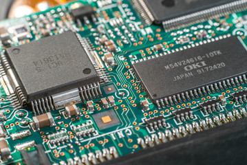 Computer chip on green motherboard closeup macro. Computer technology concept