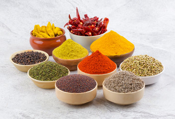 Indian Spices Collection Also Called Red Chili Powder, Turmeric Powder, Coriander Powder, Turmeric Stick, Dry Chili, Fenugreek, Black Pepper, Cumin, Mustard Seed, Mirchi, Haldi on Vintage Background