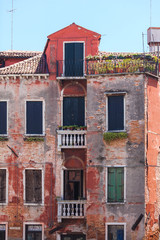 Fototapeta na wymiar Old venetian building. Red brick walls
