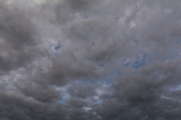 The sky covered with gray, heavy clouds.