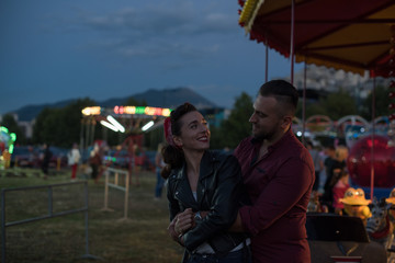 young cute  couple  amusement  park 