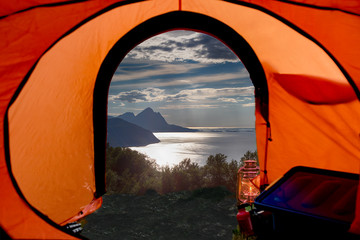 camping in the mountains, view out of a tent, norway