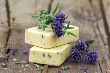 Obraz na płótnie Canvas bars of natural soap and lavender flowers