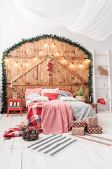 Xmas in morning bedroom. Double bed In christmas Interior on wood wall background