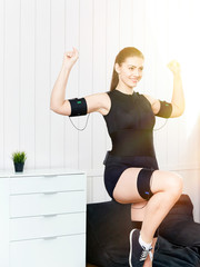 Fototapeta na wymiar Young woman in an EMS workout.