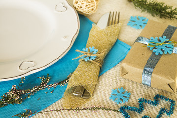 christmas table setting in blue colores of rustic style