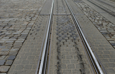 Fototapeta na wymiar Ways for a city tram. Photographed against the background of pavers.
