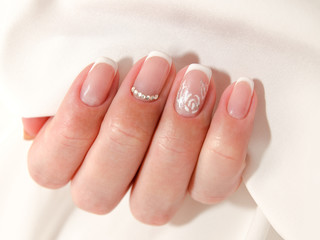  Woman's nails with beautiful french manicure fashion design