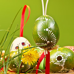 Painted easter eggs on the green background