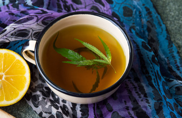 Cannabis herbal tea on stone table