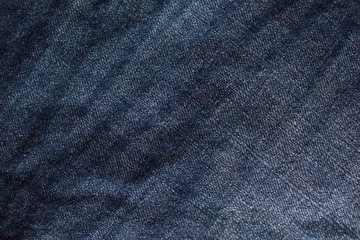 blue jeans texture wrinkles close up.