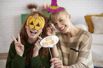 Happy friends with halloween masks