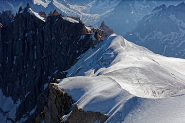 Chamonix, south-east France, Auvergne-Rhône-Alpes. Climbers heading for Mont Blanc. Descending...