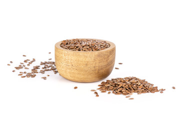 Fresh brown flaxseeds isolated on white