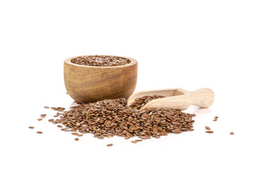 Fresh brown flaxseeds isolated on white