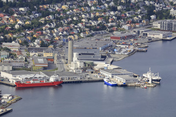 Fototapeta na wymiar Port of Tromsø city in Northern Norway - Ms Stigfoss owner Eimskip reefer