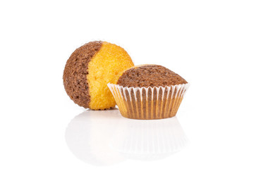 Group of two whole fresh baked marble muffin isolated on white background