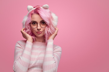 Charming hipster woman wearing earmuffs