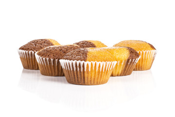 Group of six whole fresh baked marble muffin isolated on white background