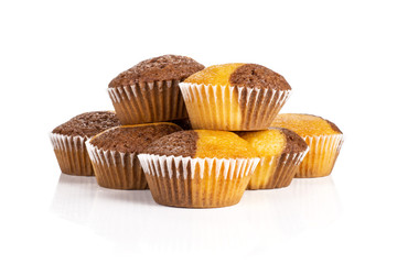 Group of seven whole fresh baked marble muffin isolated on white background