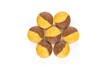 Group of seven whole sweet fresh baked marble muffin flatlay isolated on white background