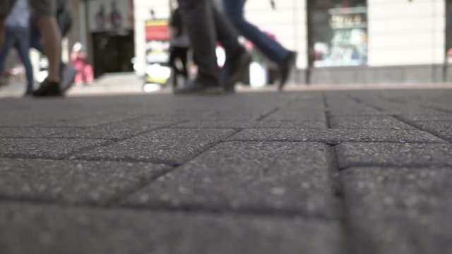 Unidentified People's Legs And Feet As They Walk In Moscow.