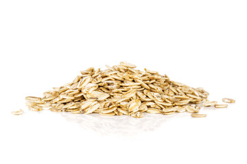 Lot of whole flat raw rolled oats heap isolated on white background