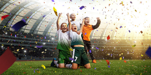 winning football player Children after score in a match confetti and tinsel